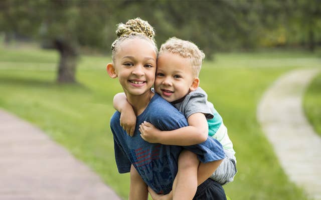 Boy and Girl recreating the he aint heavy pose