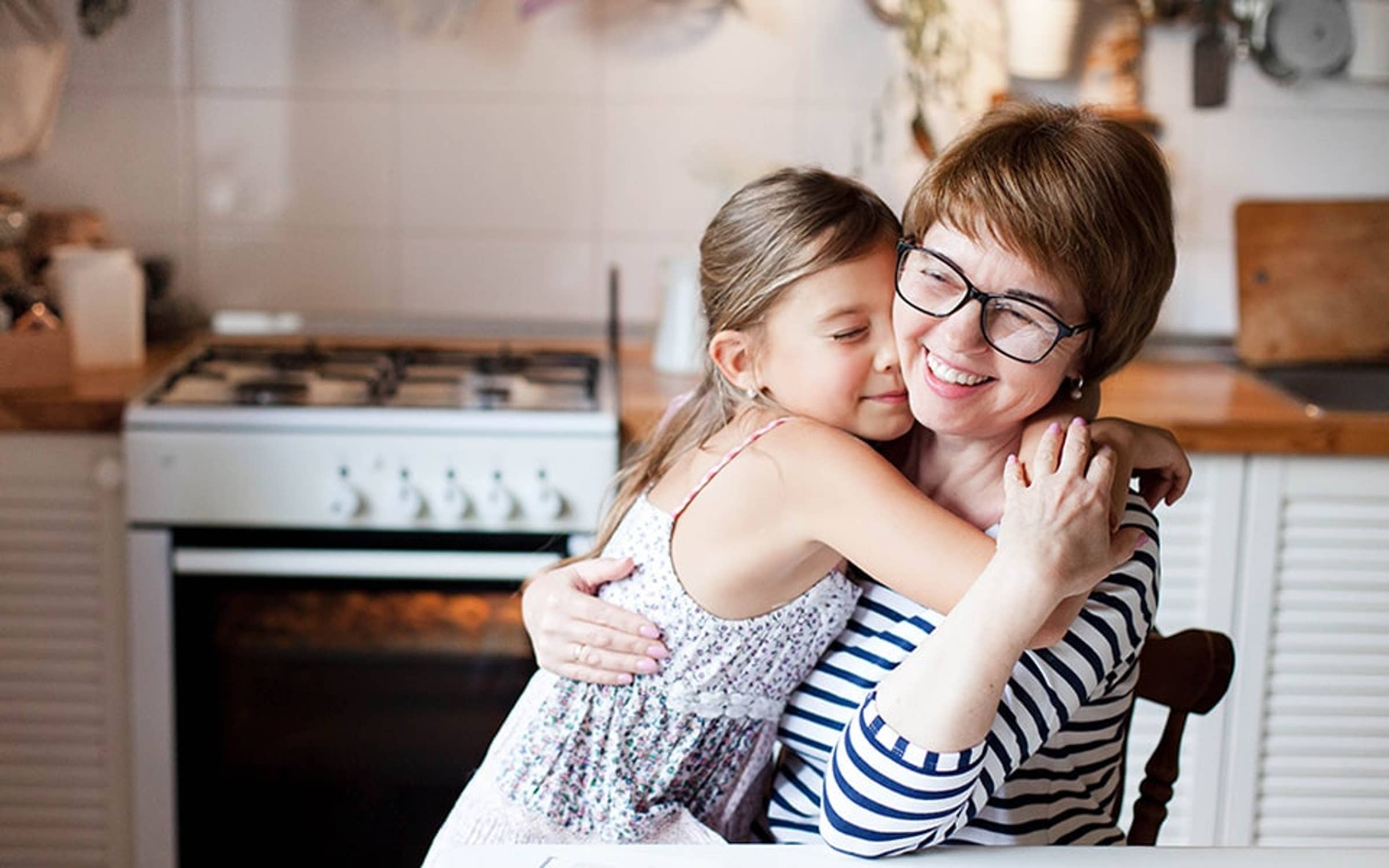 Mother and daughter hugging
