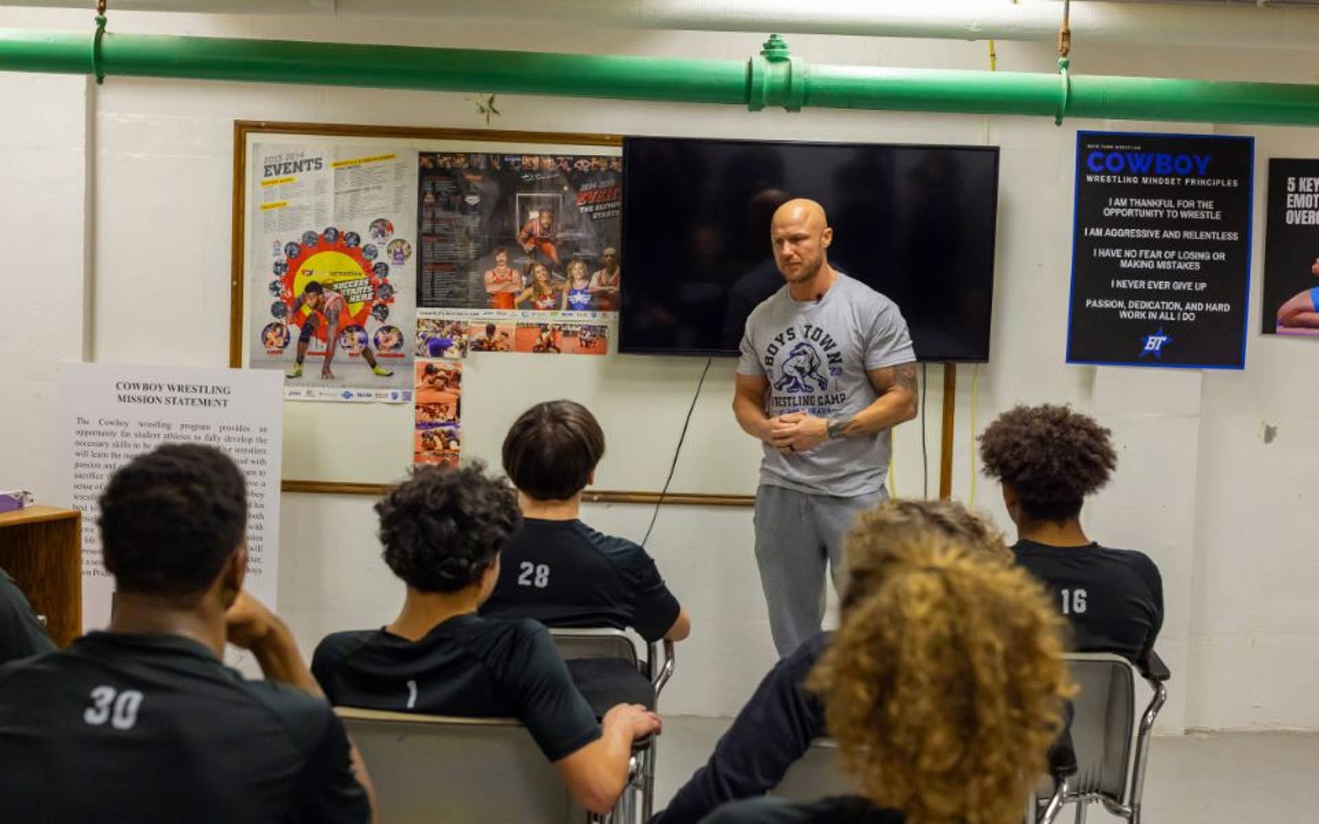 Luke Hawx talking to students