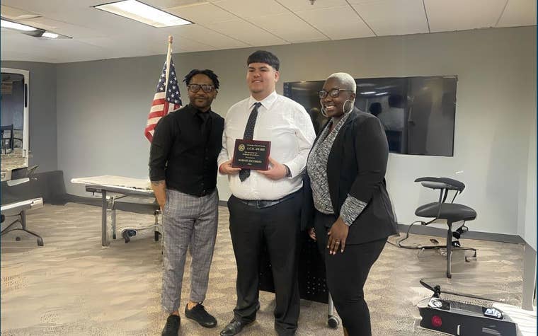 Senior Robson after winning the A.C.E. Award with his Family Teachers, Kenny and Kuori Brown
